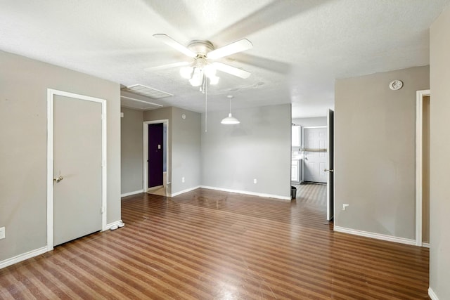 2005 Worms St, Houston, TX 77020 - spare room featuring ceiling fan, attic access, baseboards, and wood finished floors