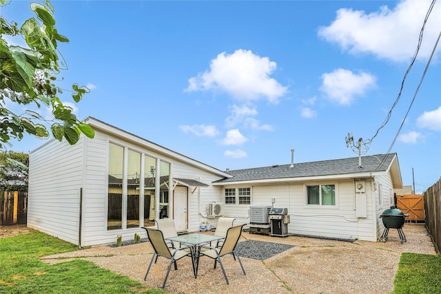 3415 80th St, Galveston, TX 77551 - rear view of property with a patio, a fenced backyard, and central AC