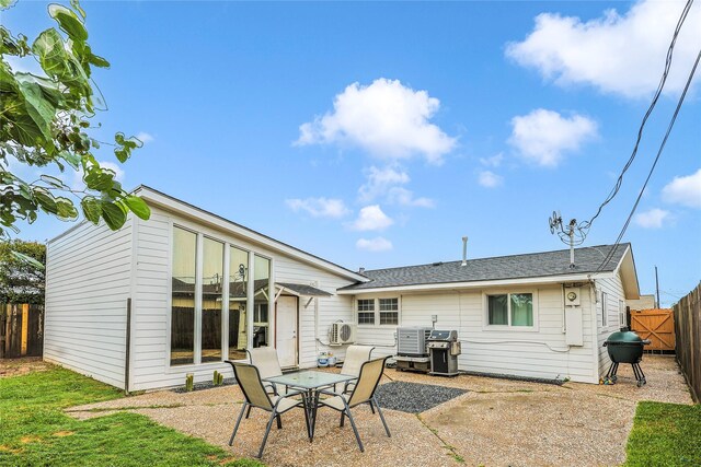 3415 80th St, Galveston, TX 77551 - back of house with a patio and a fenced backyard
