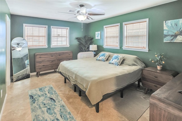 3415 80th St, Galveston, TX 77551 - bedroom with light tile patterned floors and a ceiling fan