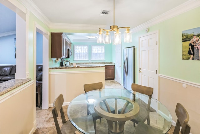3415 80th St, Galveston, TX 77551 - dining space featuring a chandelier, crown molding, and baseboards