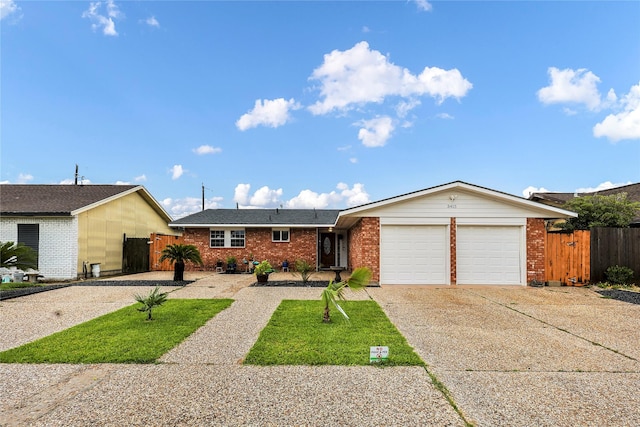 3415 80th St, Galveston, TX 77551 - ranch-style house featuring driveway, an attached garage, and brick siding