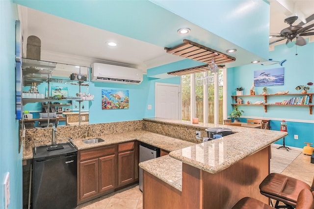 3415 80th St, Galveston, TX 77551 - kitchen featuring a wall mounted AC, light tile patterned floors, a sink, refrigerator, and recessed lighting