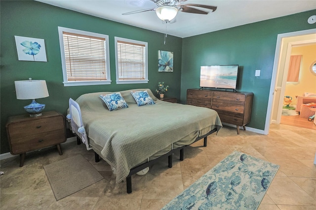 3415 80th St, Galveston, TX 77551 - tiled bedroom featuring baseboards and ceiling fan