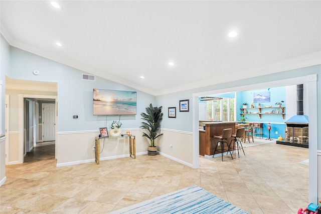3415 80th St, Galveston, TX 77551 - living room with crown molding, lofted ceiling, recessed lighting, and baseboards