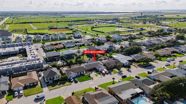 3415 80th St, Galveston, TX 77551 - aerial view of property and surrounding area featuring nearby suburban area