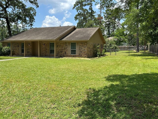 203 Ridgewood Dr, Spring, TX 77386 - single story home with brick siding and roof with shingles