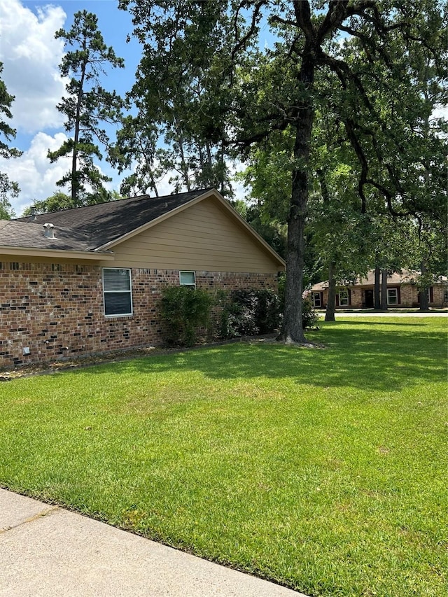 203 Ridgewood Dr, Spring, TX 77386 - view of side of property featuring brick siding and a yard