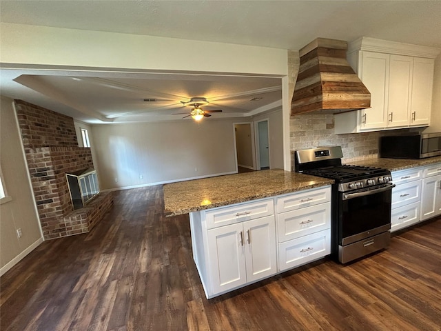 203 Ridgewood Dr, Spring, TX 77386 - kitchen featuring appliances with stainless steel finishes, custom range hood, light stone countertops, and white cabinets