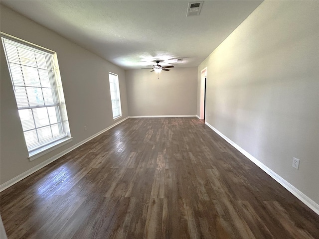 203 Ridgewood Dr, Spring, TX 77386 - unfurnished room featuring dark wood-type flooring and ceiling fan