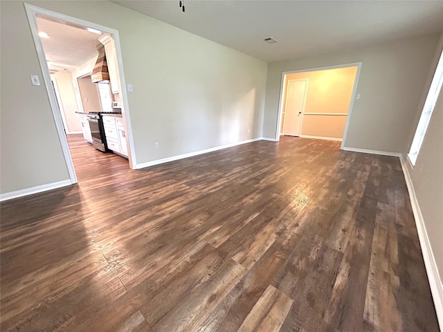 203 Ridgewood Dr, Spring, TX 77386 - spare room featuring dark wood-type flooring and baseboards