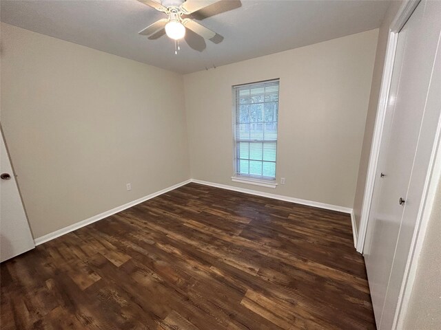 203 Ridgewood Dr, Spring, TX 77386 - unfurnished bedroom featuring dark wood-style flooring and a ceiling fan