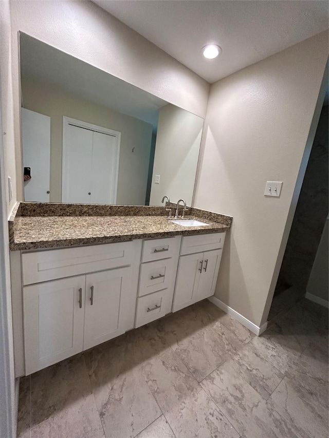 203 Ridgewood Dr, Spring, TX 77386 - full bathroom with double vanity and marble look tile flooring