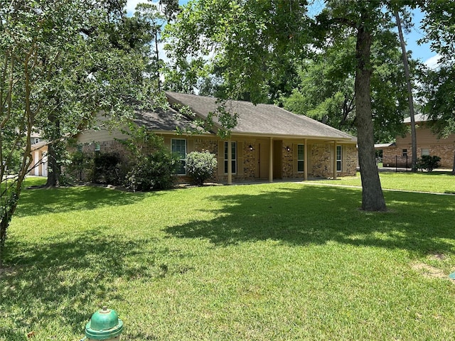 203 Ridgewood Dr, Spring, TX 77386 - view of front of house featuring a front lawn and brick siding