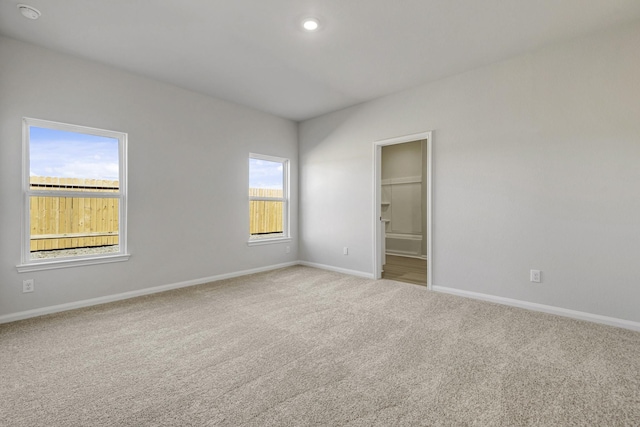 6426 Summer Pass Dr, Houston, TX 77048 - unfurnished bedroom with carpet floors, baseboards, connected bathroom, and recessed lighting