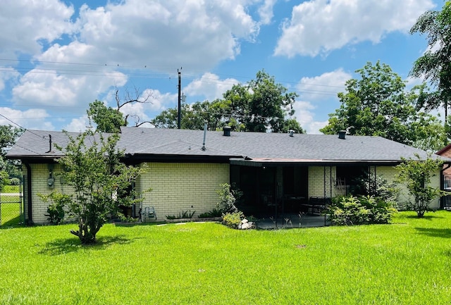 7635 Nordling Rd, Houston, TX 77037 - rear view of property featuring brick siding, a patio area, and a shingled roof