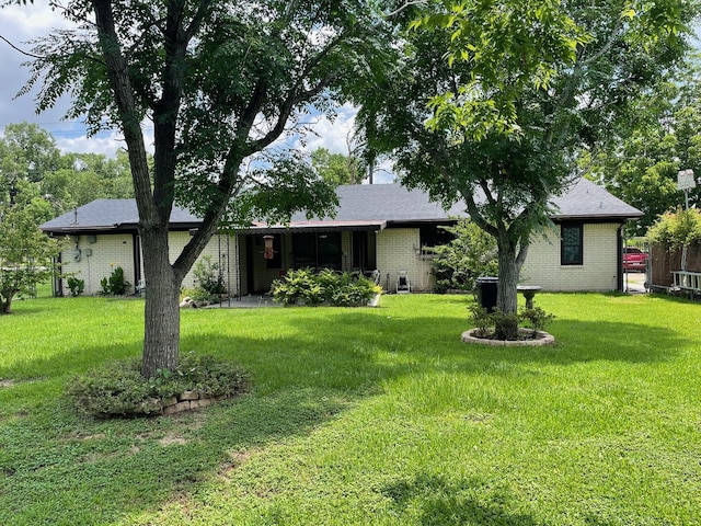 7635 Nordling Rd, Houston, TX 77037 - ranch-style house featuring a front lawn and brick siding