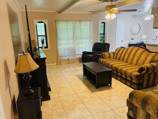 7635 Nordling Rd, Houston, TX 77037 - living area with light tile patterned floors, crown molding, a ceiling fan, a textured ceiling, and plenty of natural light