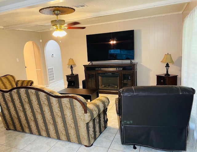 7635 Nordling Rd, Houston, TX 77037 - living area featuring ceiling fan, light tile patterned floors, and arched walkways