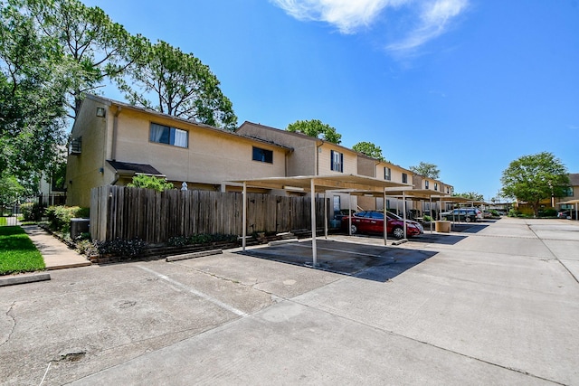 5001 Lamonte Ln Unit 14, Houston, TX 77092 - covered parking lot featuring a residential view