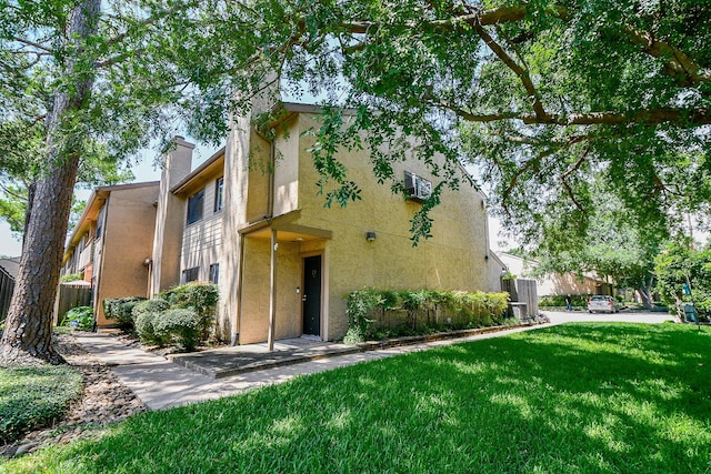 5001 Lamonte Ln Unit 14, Houston, TX 77092 - view of front facade with stucco siding and a chimney