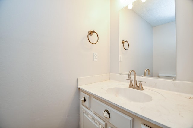5001 Lamonte Ln Unit 14, Houston, TX 77092 - bathroom with vanity, toilet, and a textured ceiling