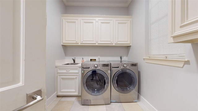 24615 W Kingscrest Cir, Spring, TX 77389 - washroom with cabinet space, washing machine and dryer, baseboards, light tile patterned flooring, and ornamental molding