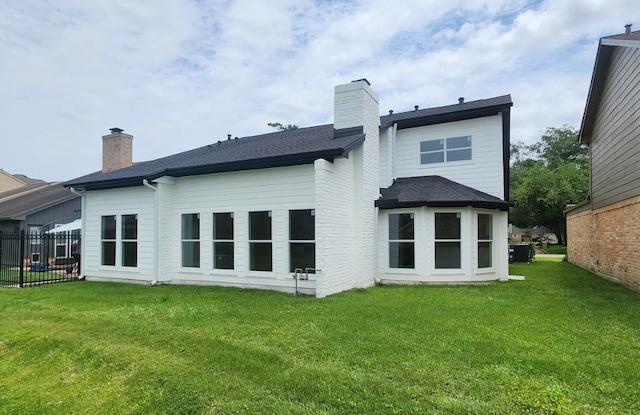 6658 Radley Dr, Spring, TX 77379 - rear view of property with a chimney, a shingled roof, and central air condition unit
