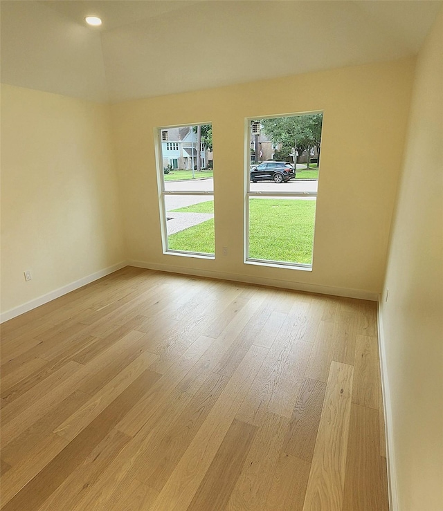6658 Radley Dr, Spring, TX 77379 - spare room featuring plenty of natural light, light wood-type flooring, and baseboards