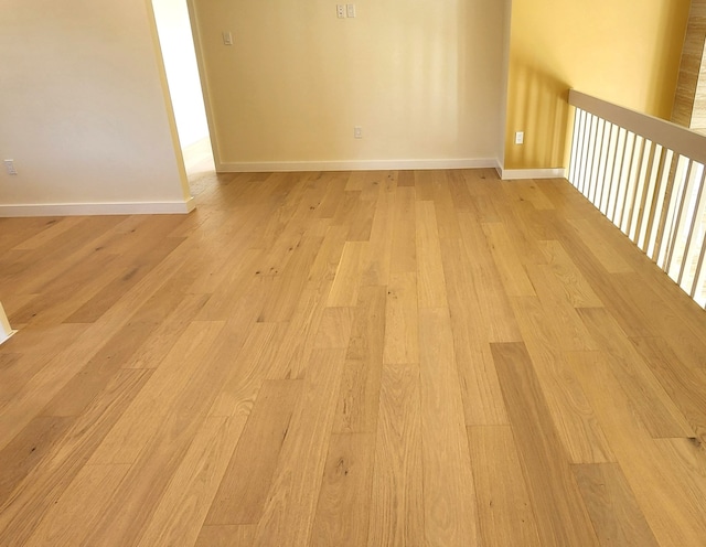 6658 Radley Dr, Spring, TX 77379 - empty room with light wood-style floors and baseboards