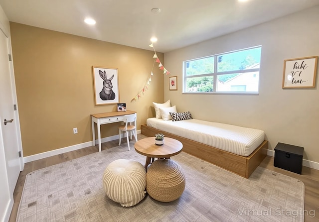 6658 Radley Dr, Spring, TX 77379 - bedroom with recessed lighting, wood finished floors, and baseboards