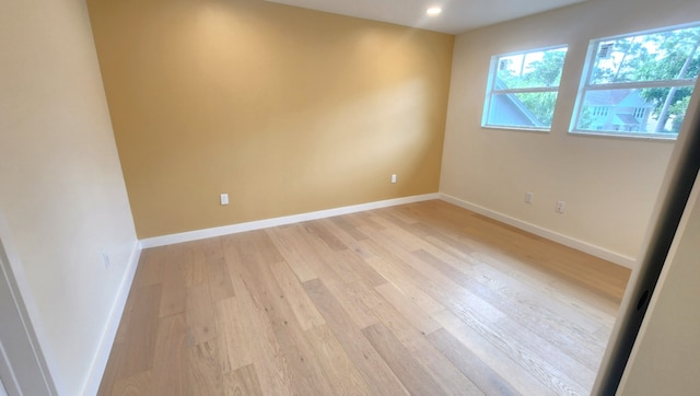 6658 Radley Dr, Spring, TX 77379 - spare room featuring light wood-style flooring, baseboards, and recessed lighting