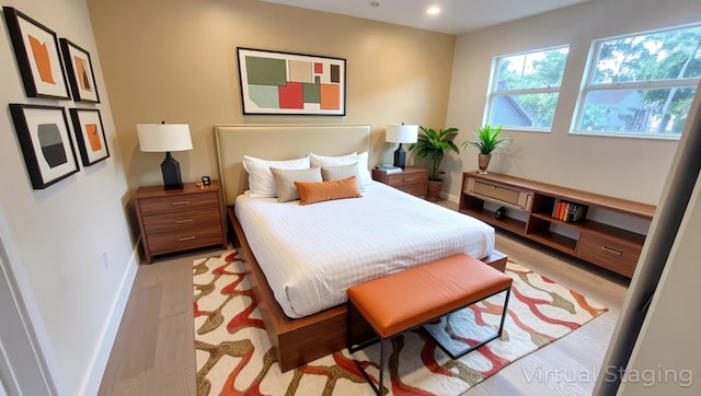 6658 Radley Dr, Spring, TX 77379 - bedroom featuring baseboards, recessed lighting, and light wood-type flooring