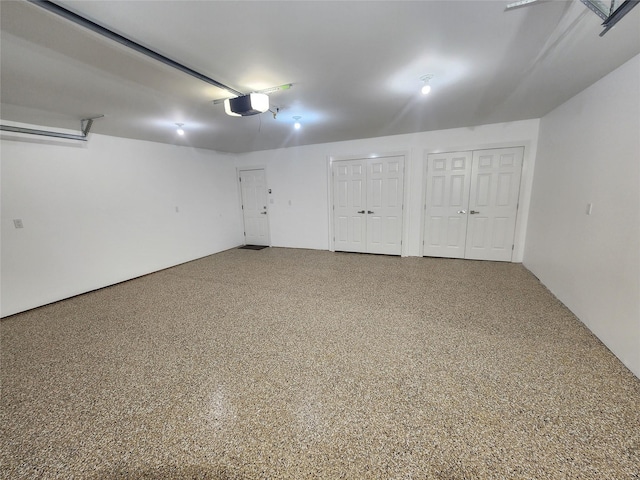 6658 Radley Dr, Spring, TX 77379 - garage featuring a garage door opener