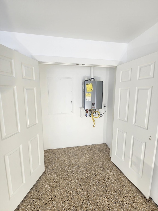 6658 Radley Dr, Spring, TX 77379 - hallway with water heater and speckle patterned floor