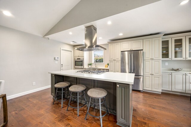 10718 Dunlap St, Houston, TX 77096 - kitchen featuring appliances with stainless steel finishes, island exhaust hood, light countertops, a kitchen breakfast bar, and lofted ceiling