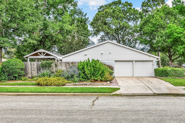 10718 Dunlap St, Houston, TX 77096 - view of front of house with driveway and a garage