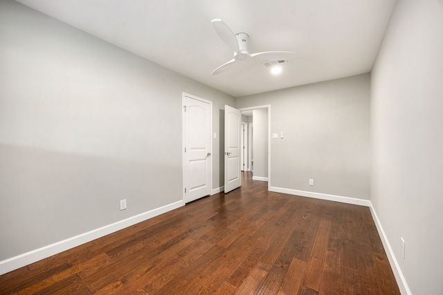 10718 Dunlap St, Houston, TX 77096 - unfurnished bedroom with baseboards, dark wood finished floors, and a ceiling fan