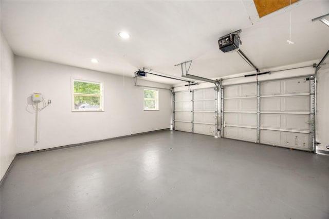 10718 Dunlap St, Houston, TX 77096 - garage with a garage door opener and recessed lighting