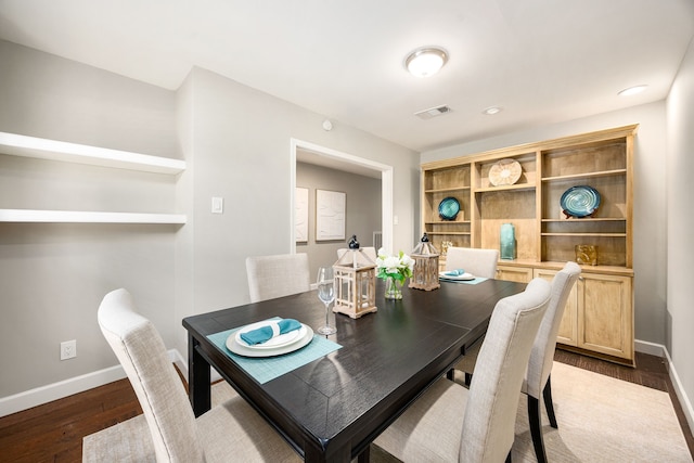 10718 Dunlap St, Houston, TX 77096 - dining space featuring baseboards and dark wood finished floors