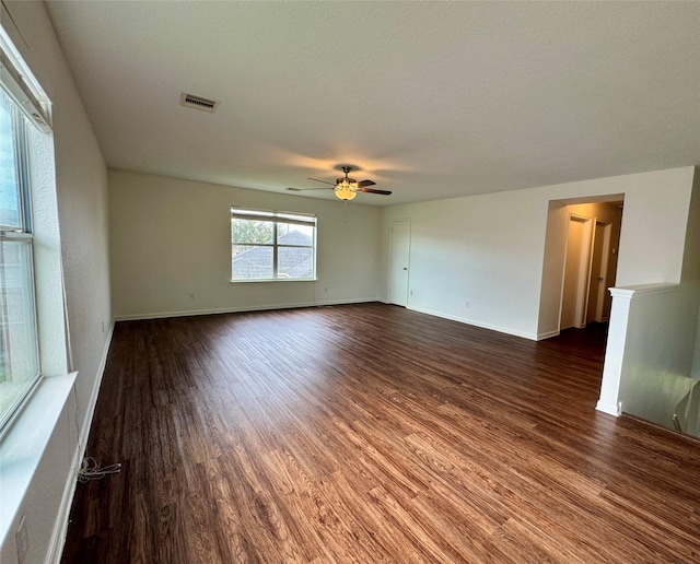 15507 Liberty Bluff Dr, Houston, TX 77049 - spare room featuring dark wood finished floors, ceiling fan, and baseboards