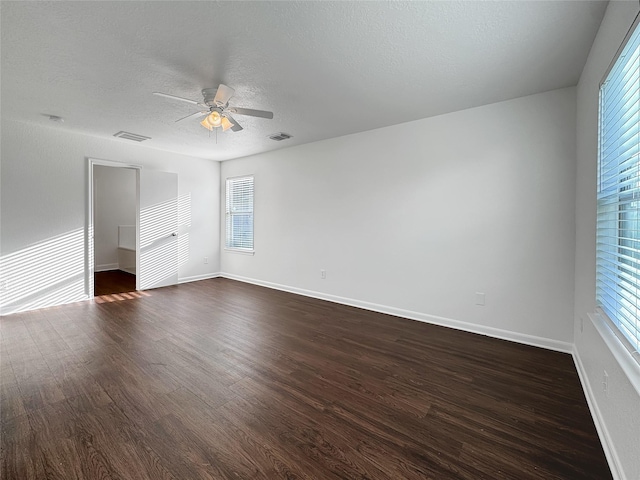15507 Liberty Bluff Dr, Houston, TX 77049 - unfurnished room with a ceiling fan, dark wood-type flooring, and a textured ceiling
