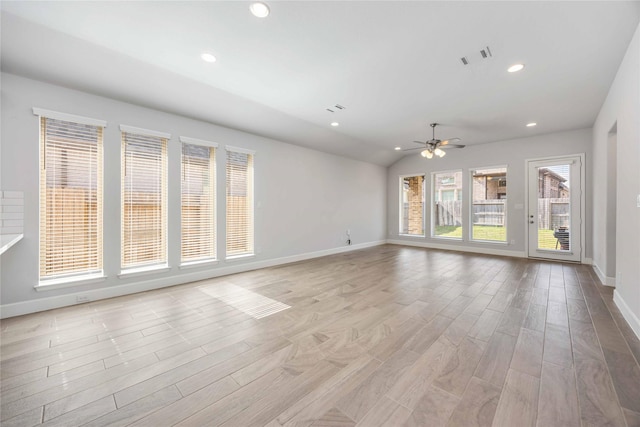 15711 Autumn Sun Ct, Conroe, TX 77302 - unfurnished living room featuring ceiling fan, baseboards, light wood-style floors, recessed lighting, and lofted ceiling