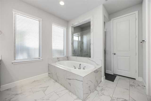 15711 Autumn Sun Ct, Conroe, TX 77302 - bathroom featuring baseboards, marble finish flooring, a bath, and recessed lighting