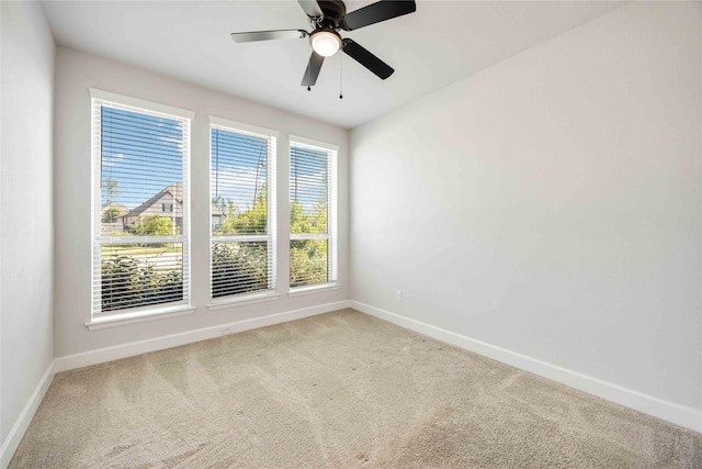 15711 Autumn Sun Ct, Conroe, TX 77302 - carpeted spare room with baseboards and ceiling fan