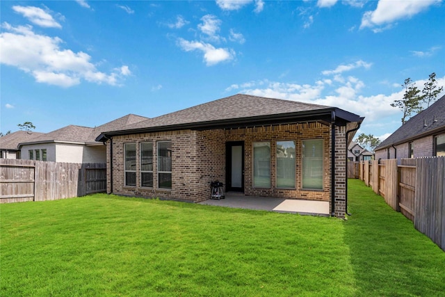15711 Autumn Sun Ct, Conroe, TX 77302 - back of property featuring brick siding, a patio, and a shingled roof