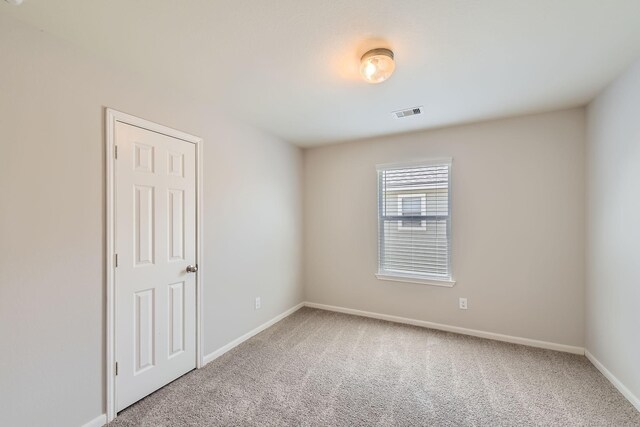 7607 Friesian Meadow Ln, Humble, TX 77338 - spare room featuring carpet flooring and baseboards