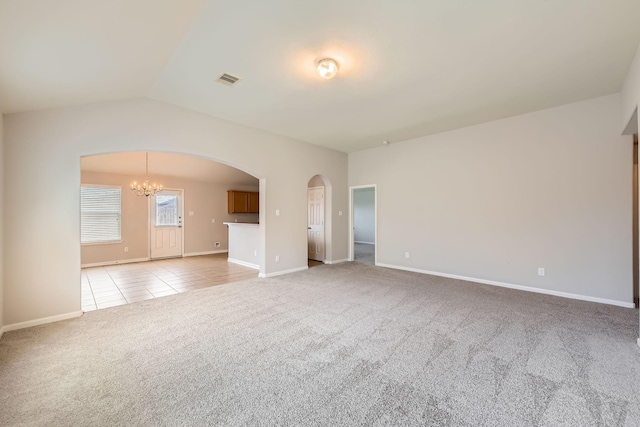 7607 Friesian Meadow Ln, Humble, TX 77338 - spare room with a chandelier, light carpet, arched walkways, baseboards, and light tile patterned flooring