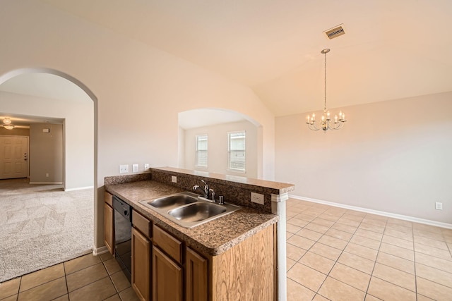 7607 Friesian Meadow Ln, Humble, TX 77338 - kitchen with arched walkways, a sink, dishwasher, light tile patterned flooring, and vaulted ceiling