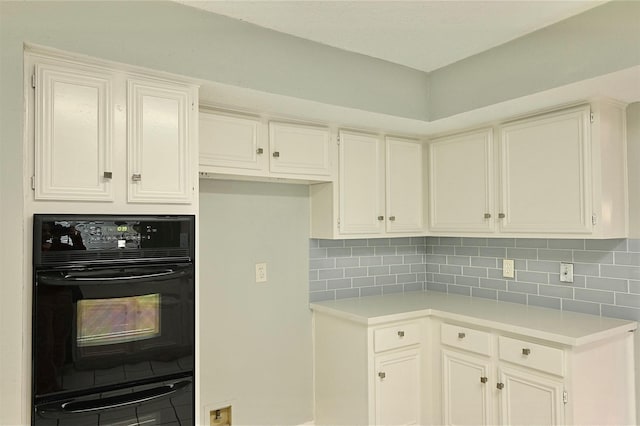 3114 Hollow Creek Ct, Houston, TX 77082 - kitchen featuring light countertops, decorative backsplash, and white cabinetry